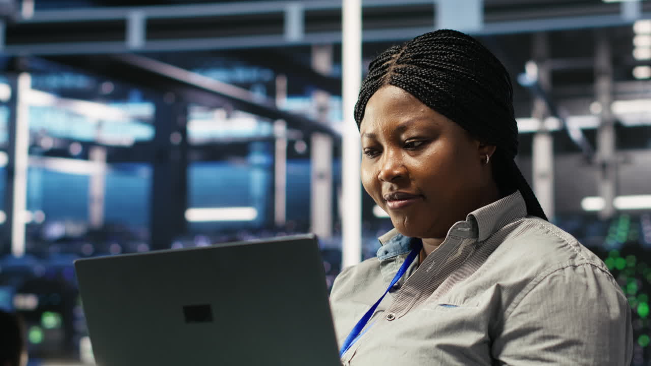 Cheerful data center employee using node tree software to analyze datasets