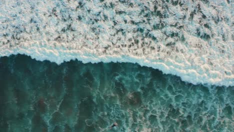 Top-down-view-of-surfers-at-Canggu