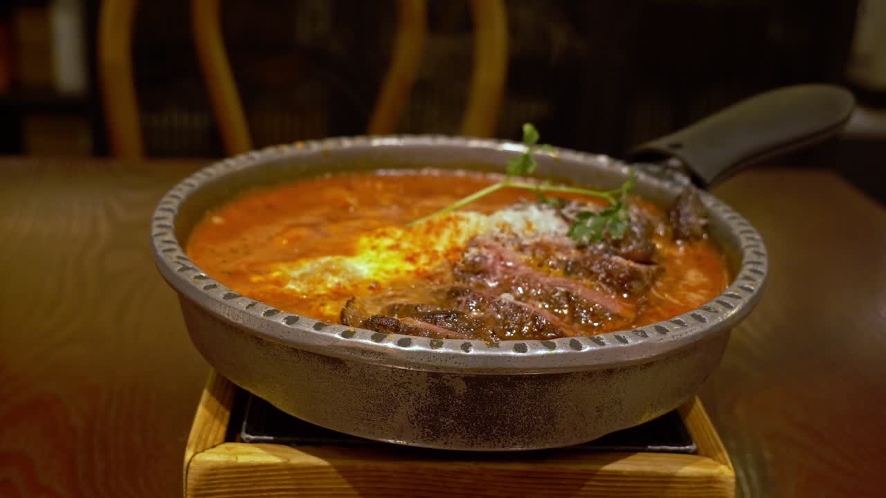 Freshly Cooked Steak Shakshuka Dish On Pot Served At Middle Eastern Restaurant. - closeup shot