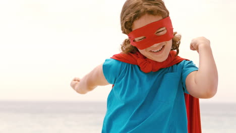 smiling little boy dressed as superman