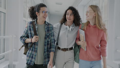 students walking through a university corridor