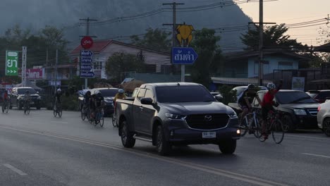 vehicles and bicycles crossing an urban intersection