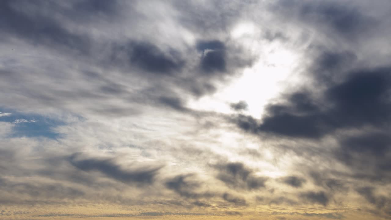 dramatic cloudy sky with sunlight breaking through dark clouds birds flying scenic nature background