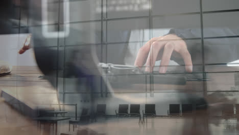 animation of person using computer keyboard with people walking in fast pace in background