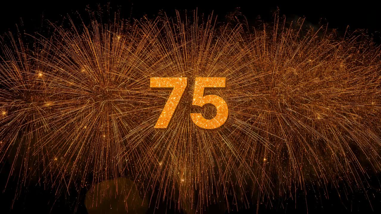 Igniting launch flame sending golden fireworks behind centered glittery 75 at night, smoke rising