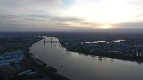 Drone-view-over-the-river-la-Garonne-in-Bordeaux-city-sunset-time.