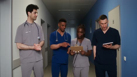 medical team discussion in hospital corridor