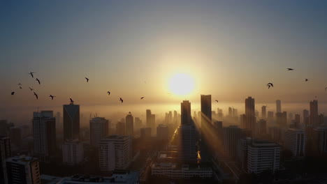 sunrise over city skyline