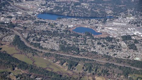 Two-Lakes-Amidst-Urban-Area-with-Scattered-Greenery---Sunny-Day-Aerial