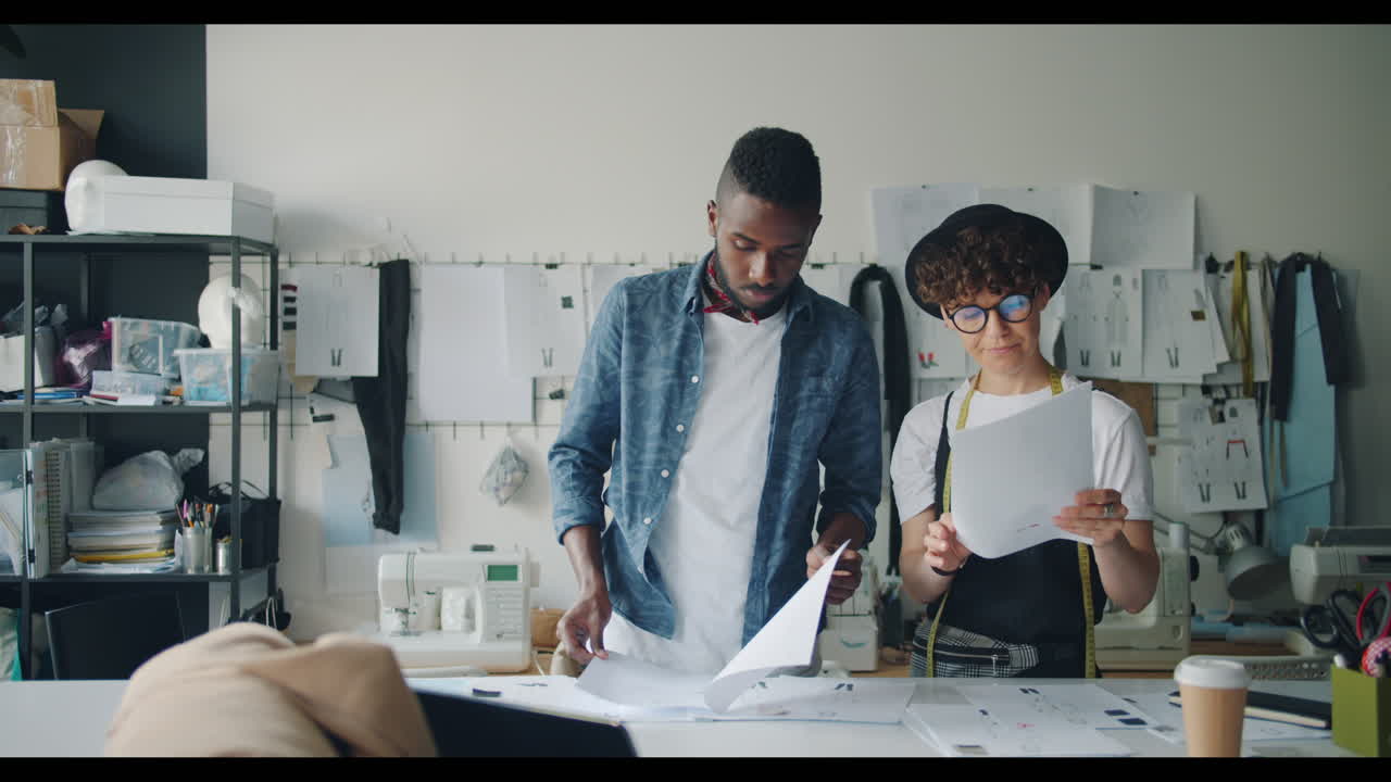 Fashion Designers Collaborating in a Studio