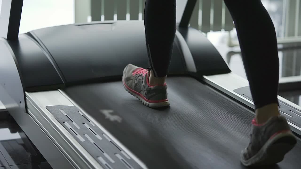 Woman Running on Treadmill