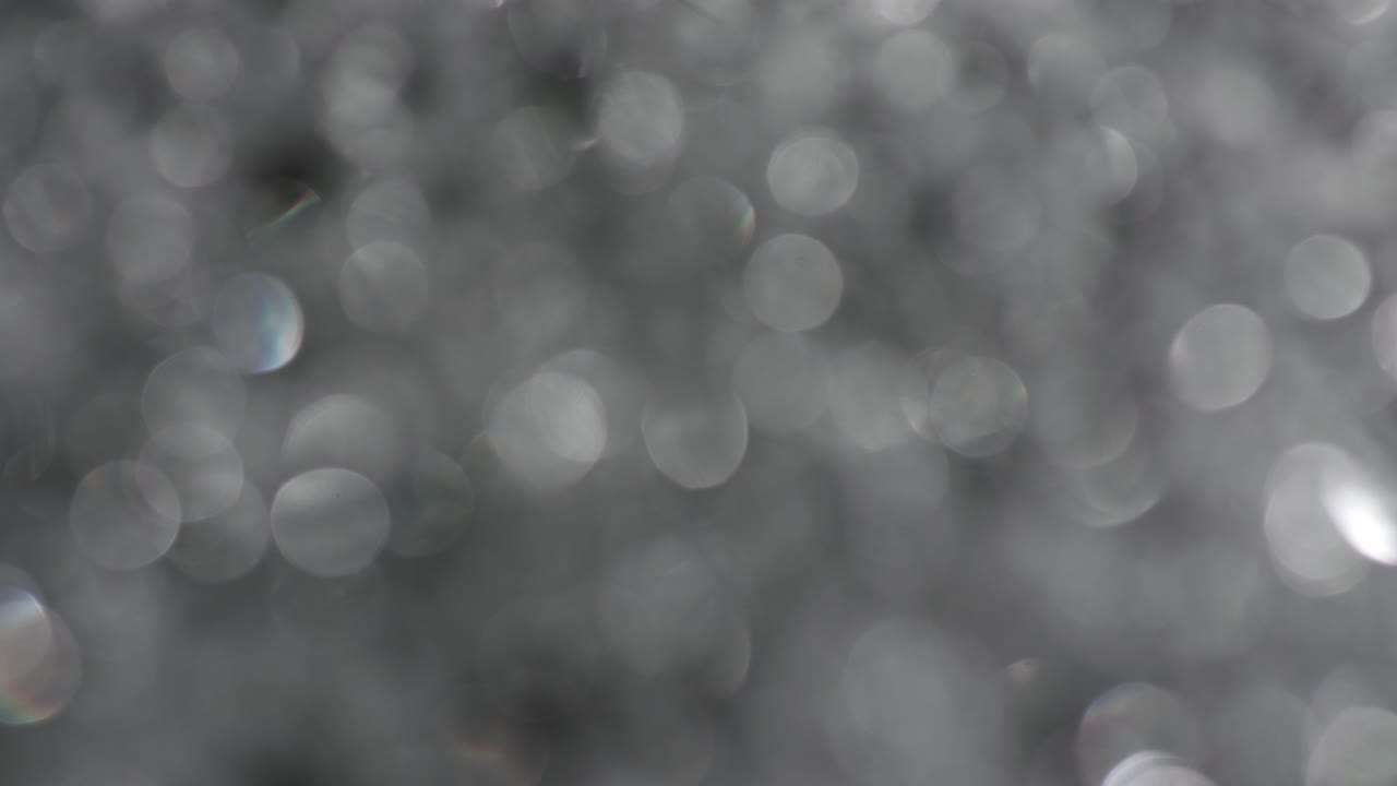 la rotación de los círculos bokeh en el sentido de las agujas del reloj