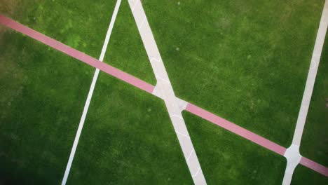 Aerial-of-a-grass-university-quad-park-on-a-campus