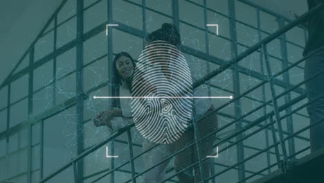 fingerprint scanning animation over people walking on stairs in modern building