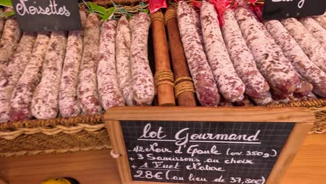 variety of sausages displayed at a market stall