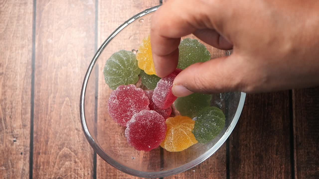 Gummy fruit candies in a bowl