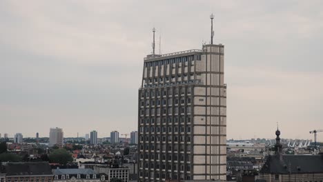 Pan shot of Antwerp’s skyline, highlighting the iconic brutalist Police Tower in the foreground