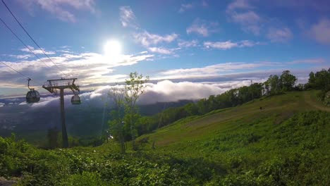 mountaintop view with cable car and clouds