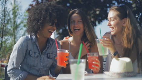 cheerful friends enjoying drinks