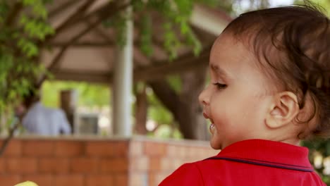 cute-toddler-eating-kulfi-the-authentic-indian-local-ice-cream-at-outdoor