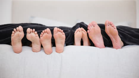 sleeping, bed and feet of family wake up