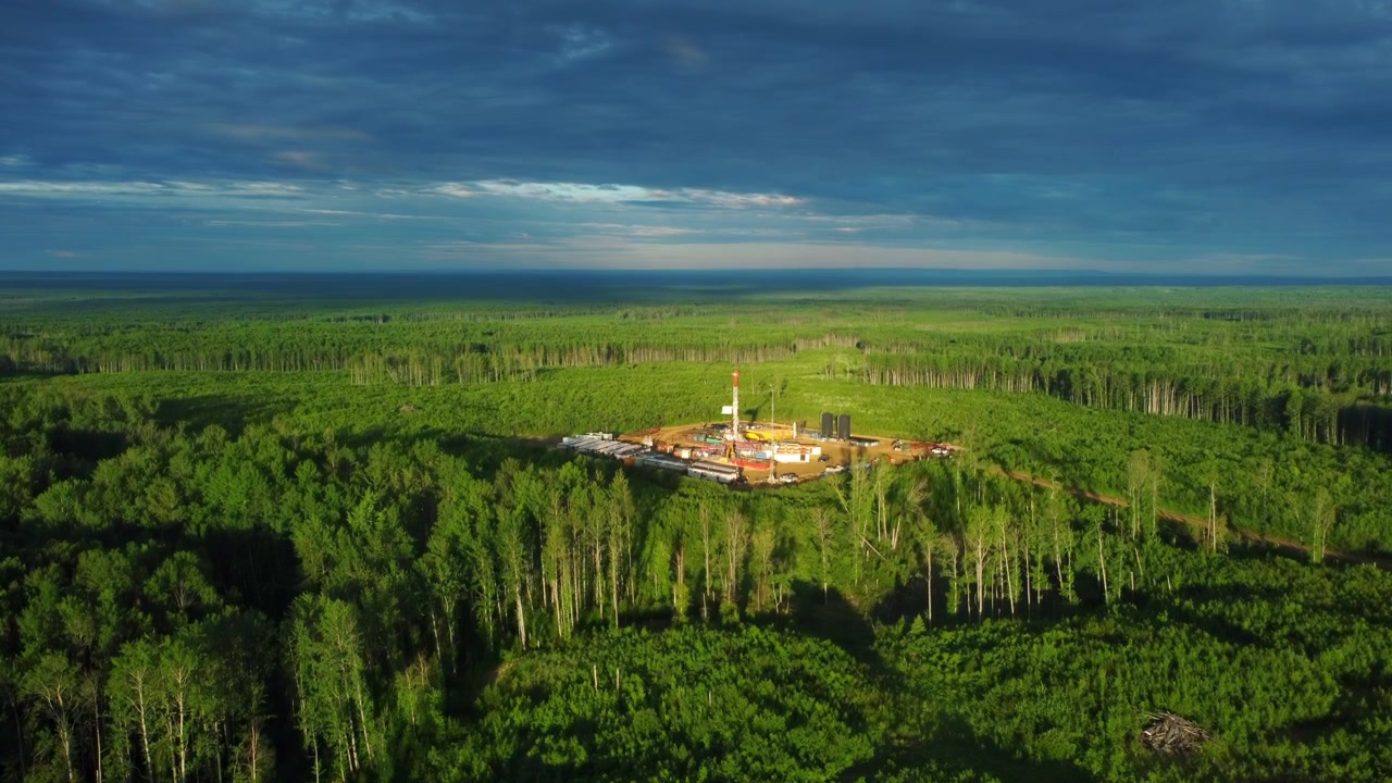 Rising Aerial Shot Over Morning Drilling Rig in Canada