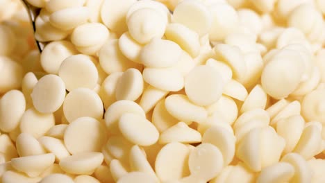 close-up view of white chocolate chips moving