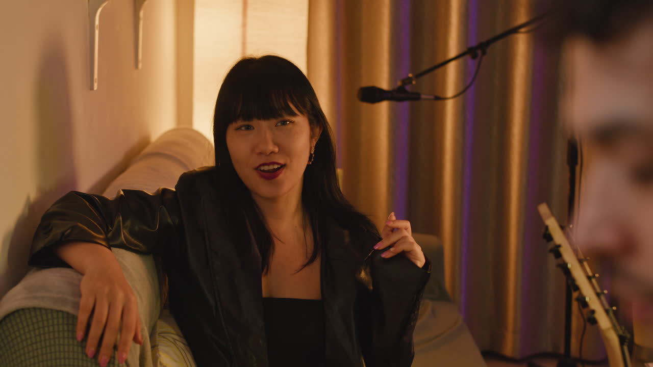 Woman and man singing indoors