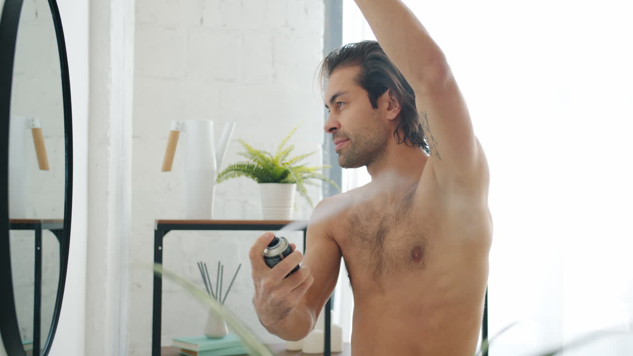 Man Applying Deodorant in Bathroom