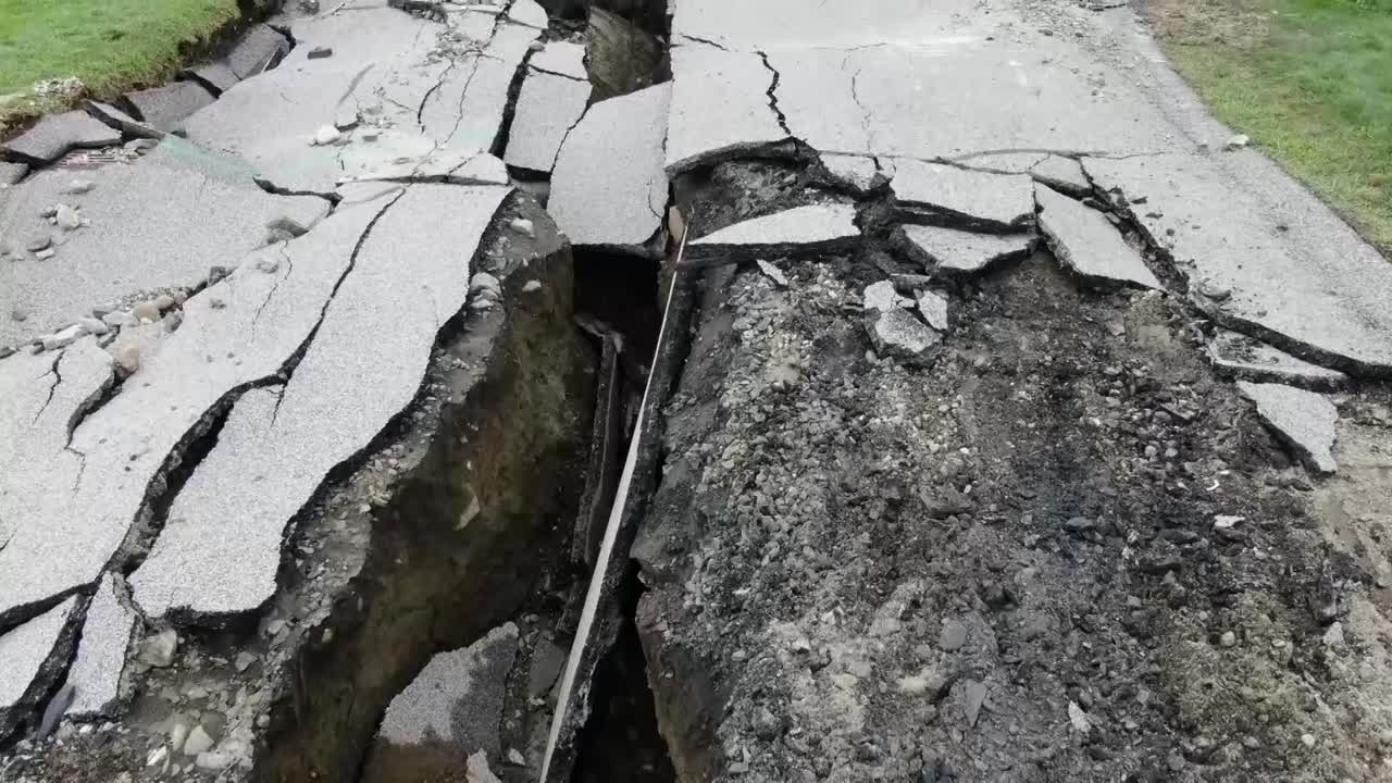 CRUSHED BROKEN ROAD FROM EARTHQUAKE DRONE