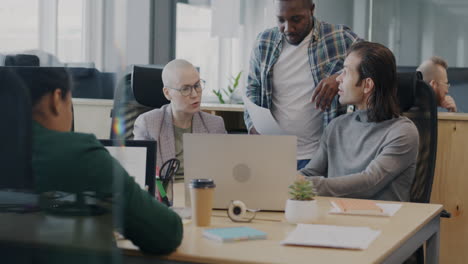 diverse team meeting in modern office