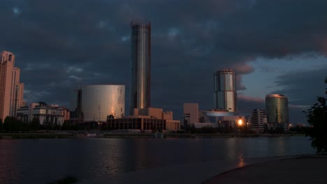 city skyline at dawn/dusk over river