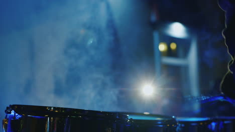 drummer's hands playing drums