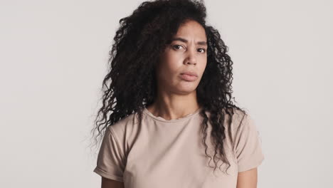 african american dissatisfied woman over white background.