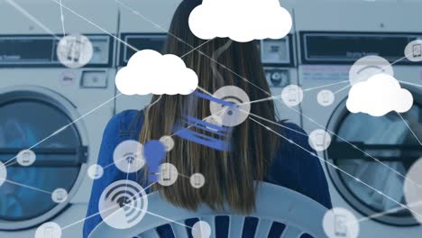 Animation-of-network-of-connections,-clouds-and-percent-going-over-woman-in-launderette