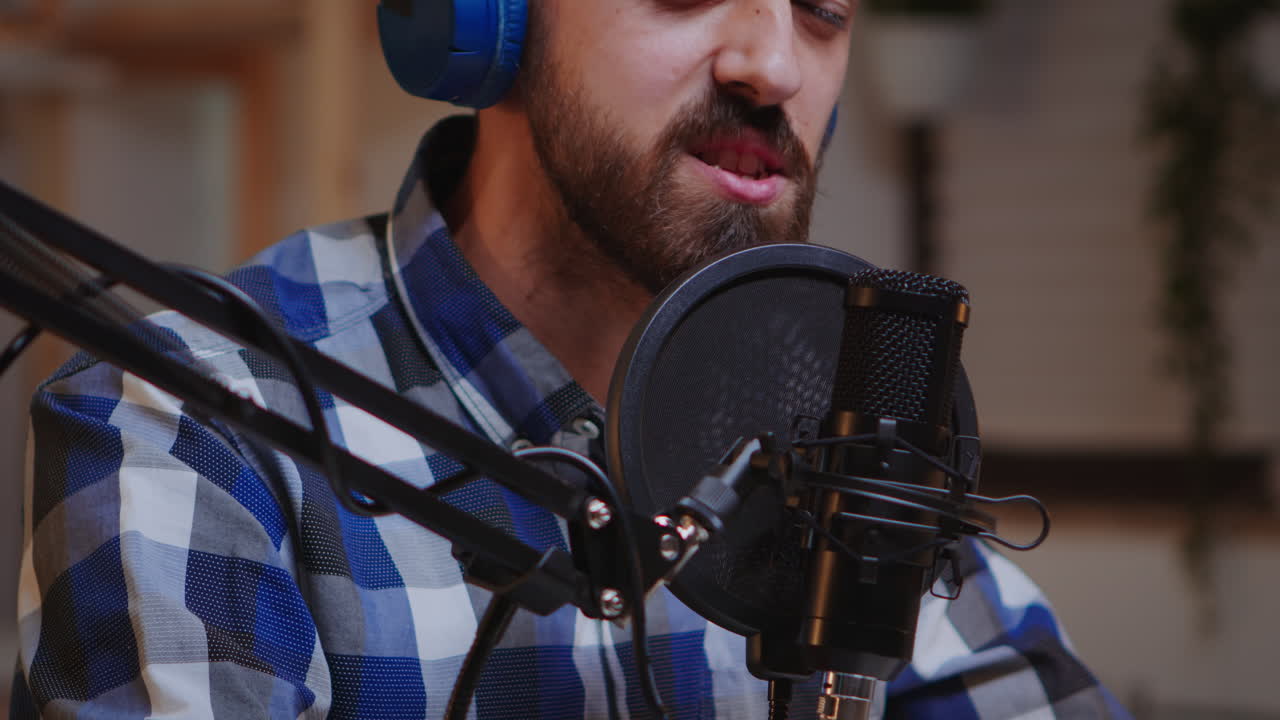 Close up of vlogger holding micophone