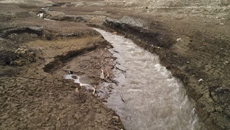 dry creekbed with water flowing