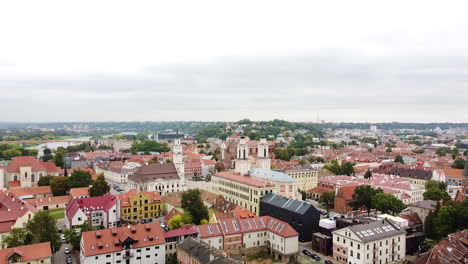 majestic rooftops of kaunas old town, aerial flying forward view