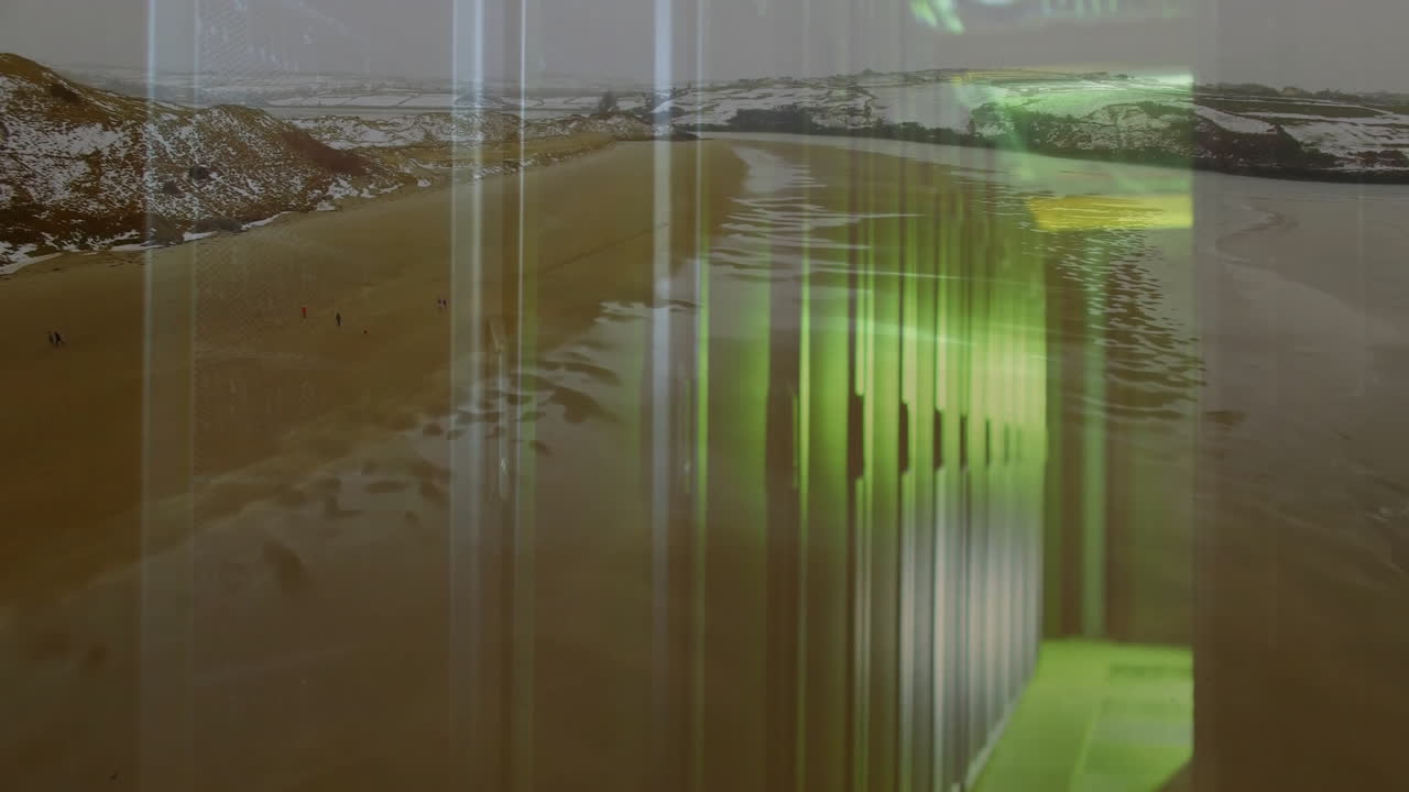 Green light animation over sandy beach landscape with hills in background