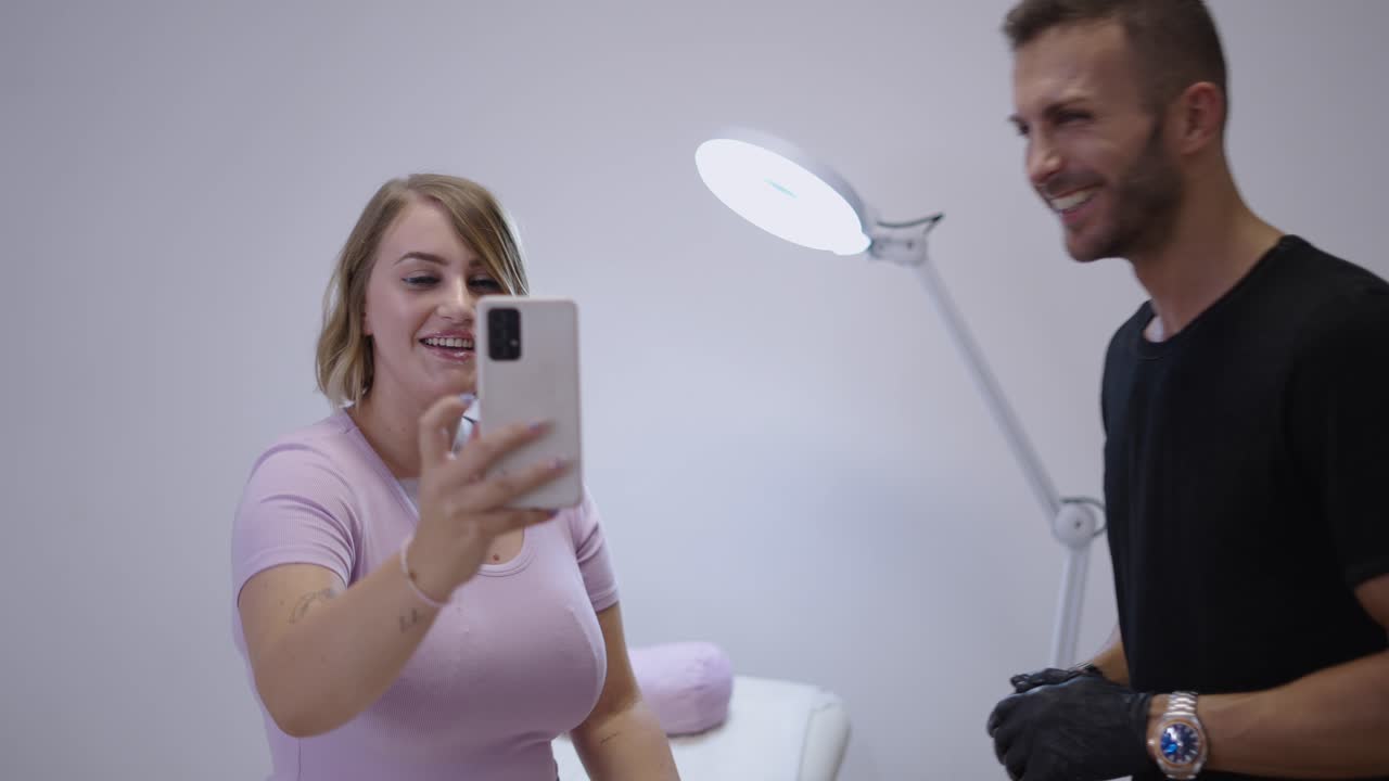 Woman recording a video with her smartphone in a beauty or studio setting