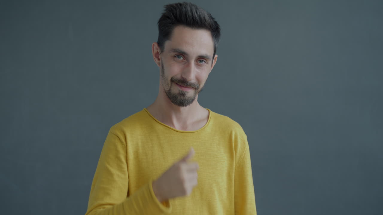 Man Making Phone Gesture