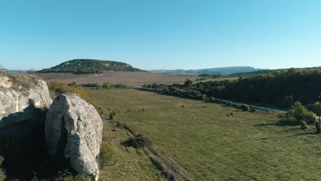 scenic valley landscape with cliffs and rolling hills