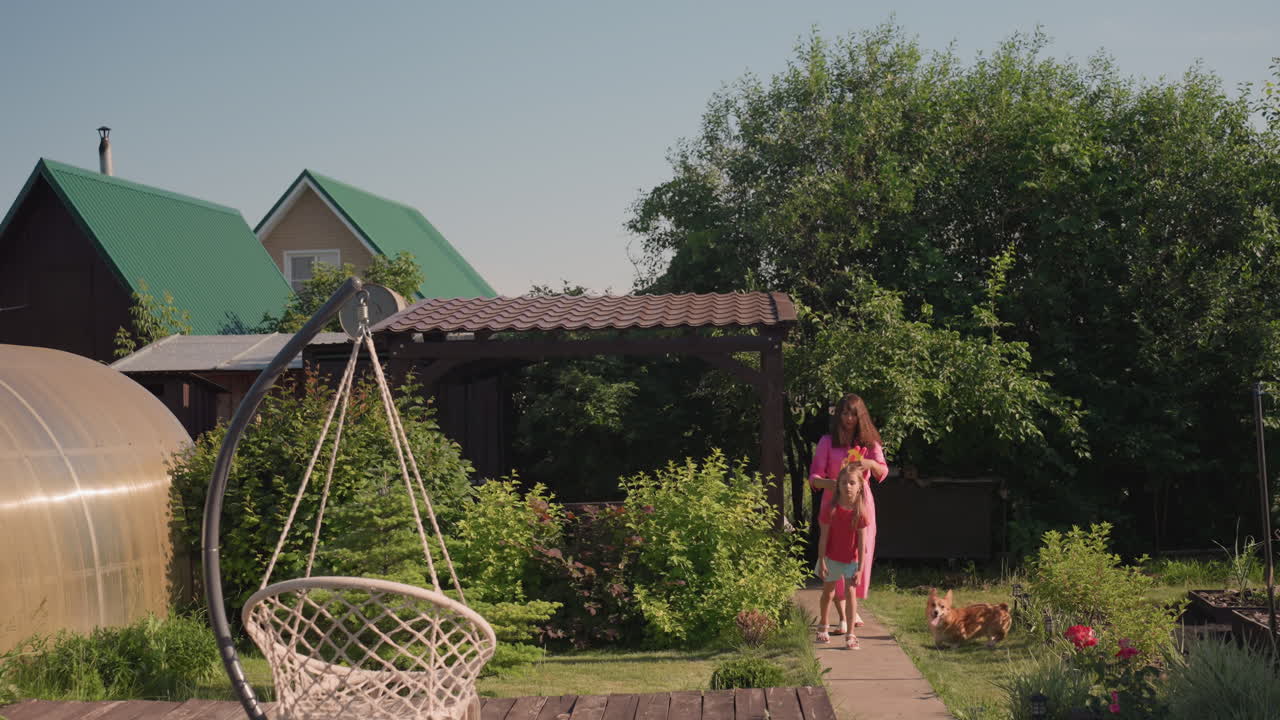 Serene Summer Scene Featuring Gentle Outdoor Stroll, Calm Woman Wanders Through Lush Garden Under Bright Sunlight, Tranquil Summer Afternoon With Woman In Pink Leisurely Exploring Lush Backyard