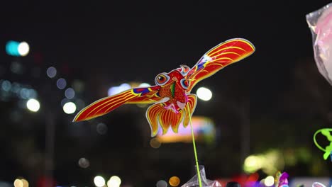 colorful toy fish in bustling night market