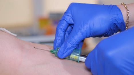 laboratory worker doctor takes a blood sample for analysis, hand closeup. blood sampling in the laboratory. taking a blood in cosmetology clinic before prp therapy procedure. healthcare and beauty concept..