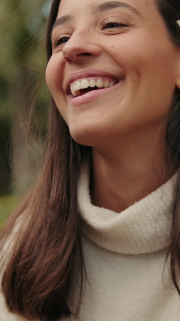 Close up young man putting flower behind his girlfriend's ear