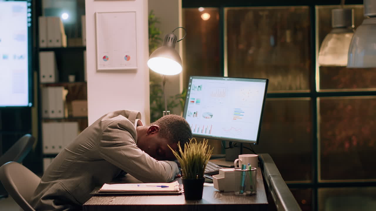 Exhausted Businessman Sleeping at His Desk