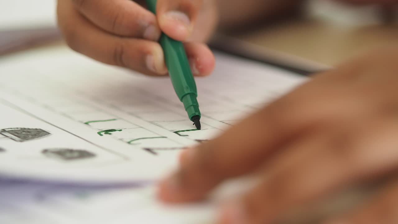 A child practices handwriting