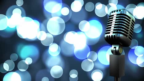 Retro-metallic-microphone-against-spots-of-light-against-blue-background
