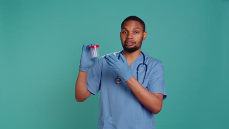 Portrait-of-nurse-holding-blood-sample-container,-doing-medical-investigation